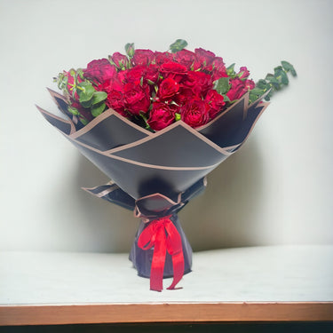 Red Rose Ensemble, Mixed Red Roses, Spray Roses, Eucalyptus, Black Wrapping